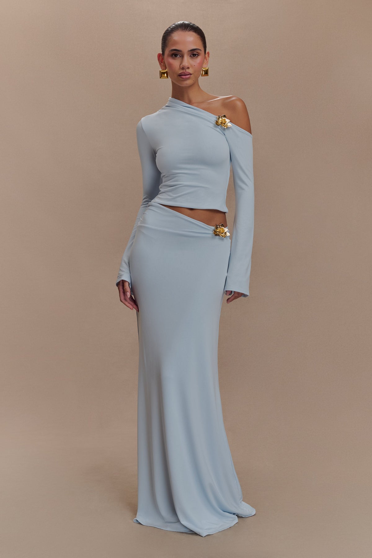 Ainsley Asymmetrical Long Sleeve Top With Floral Hardware - Pale Blue