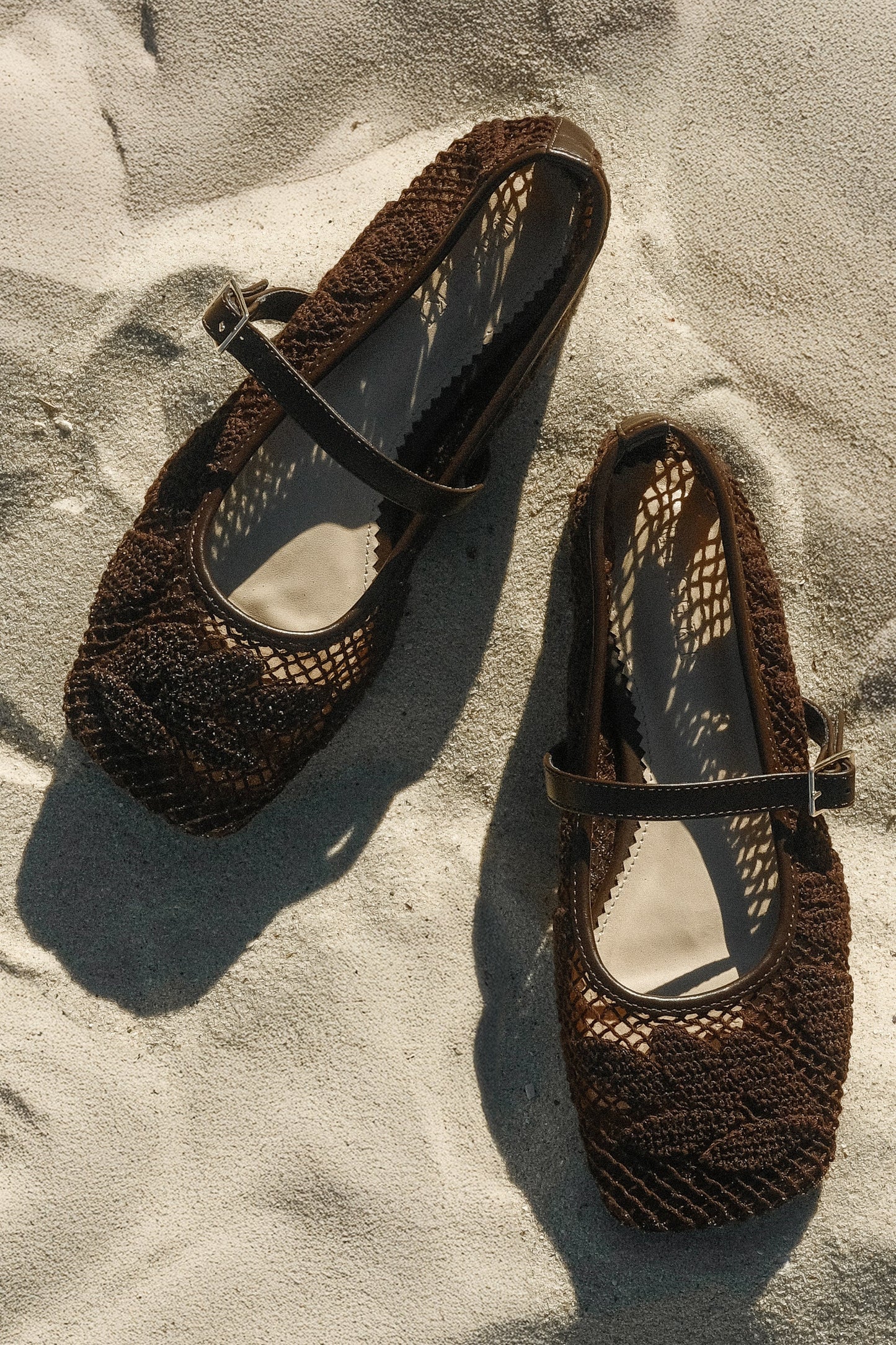 Brown lace applique flats.
