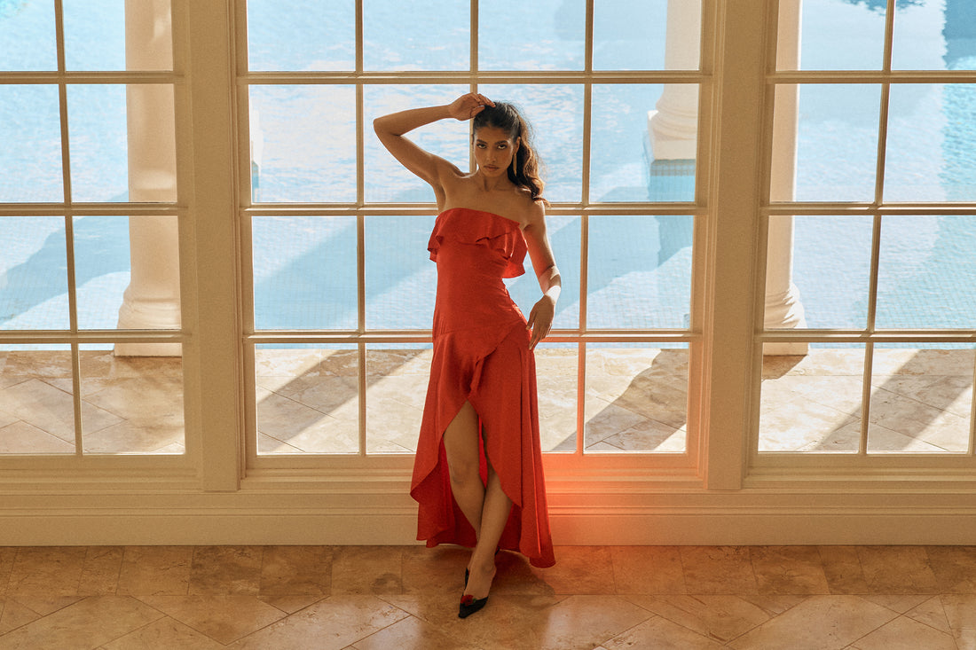Image of red ruffle strapless midi dress