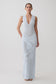 Woman wearing a light blue floral knit maxi dress.