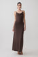 Woman wearing a dark chocolate cowl maxi dress.
