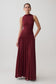 Woman wearing a dark red high neck modal maxi dress.