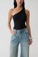 Woman wearing a black asymmetric back ponte bodysuit.
