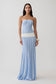 Woman wearing a blue and white striped maxi knit dress.