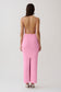 Woman wearing a strappy back bandage maxi dress.