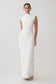 Woman wearing a white dress against a plain background