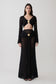 Woman wearing crochet long sleeve cropped top with matching maxi skirt.
