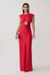 A woman modeling a bright red sleeveless maxi dress with a square neckline, a wrap-style cutout at the waist, and a fitted floor-length silhouette, photographed against a plain light gray studio background.